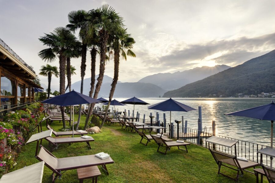 Gardens and sun loungers on the lakefront at sunrise, Swiss Diamond Hotel Lake Lugano