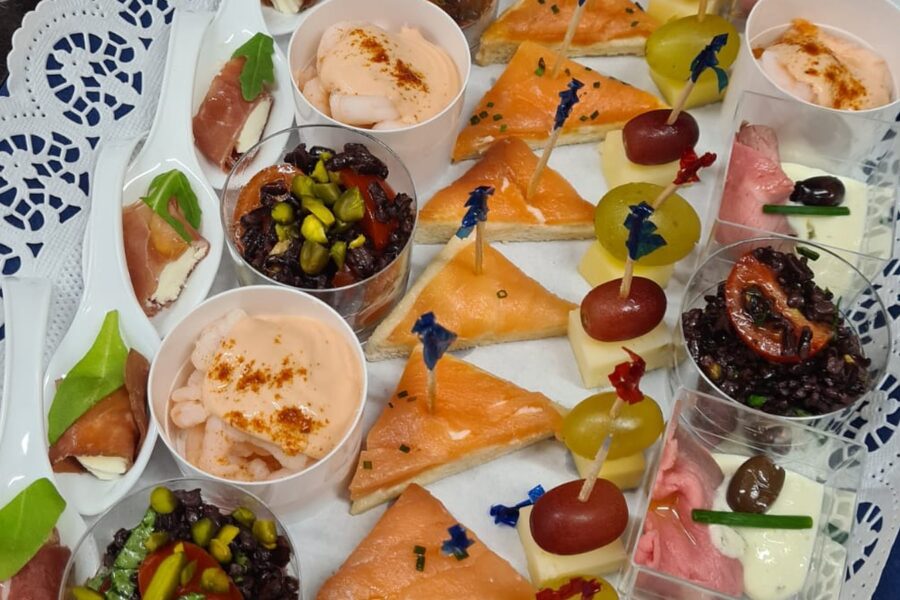 A platter of salmon rolls and canapés