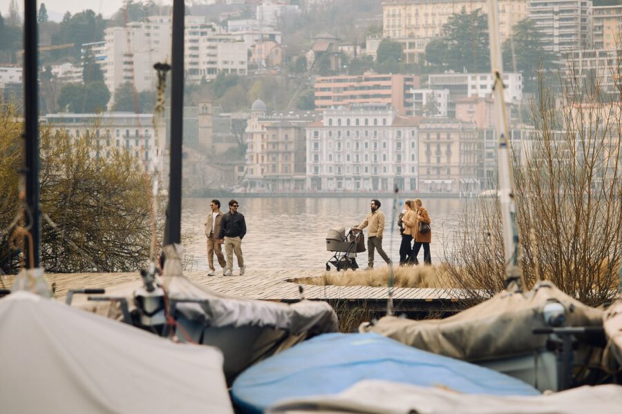 The lakeside in Lugano in spring, with the city rising behind it