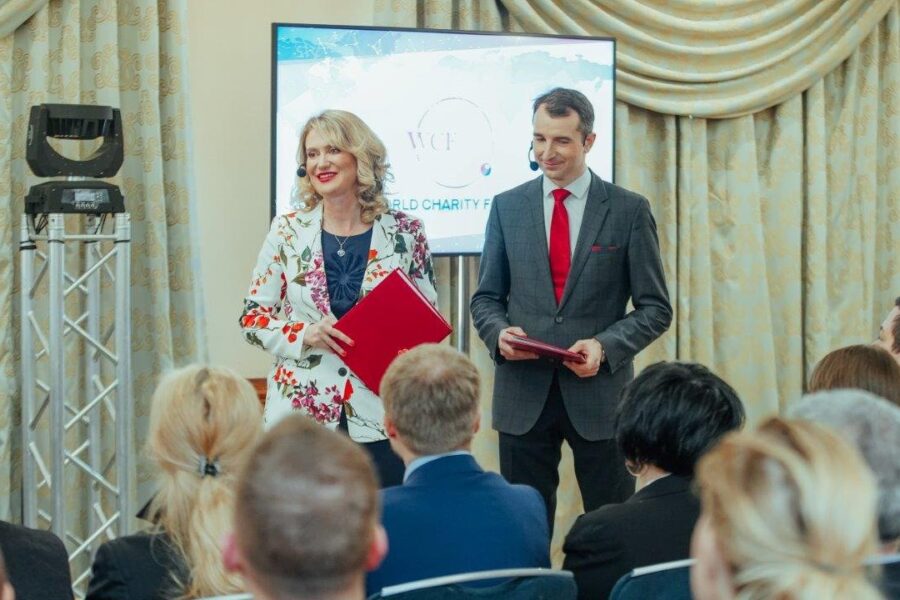 Award presentation on stage at the World Charity Forum